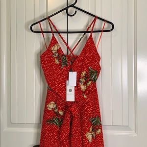Red floral split leg jumpsuit.